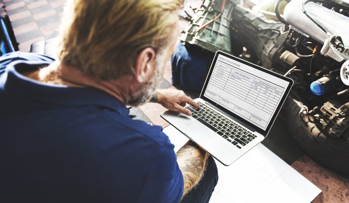 A mechanic working with his laptop